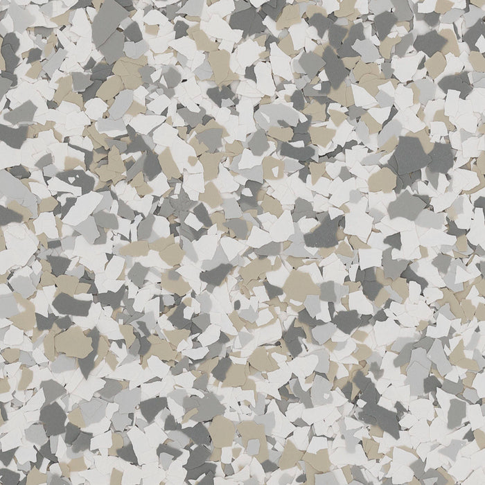 Top-down view of Antler epoxy flake – 1/4" light tan blend for decorative floors.