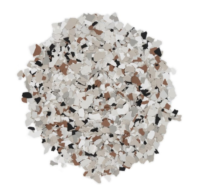 Coyote flake in 1/4" size – pile of epoxy floor flakes with natural tan, white, gray, and black color blend
