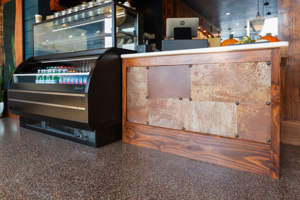 Close-up of Robin flake epoxy flooring highlighting the deep red and brown contrast.