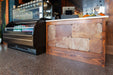 Close-up of Robin flake epoxy flooring highlighting the deep red and brown contrast.