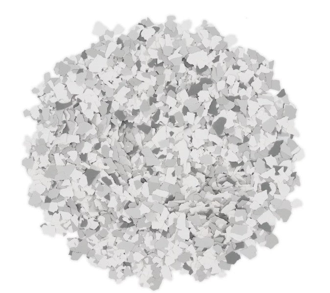 Pile of Silver Bells 1/4" flakes showing the cool gray and white color mix for epoxy systems.